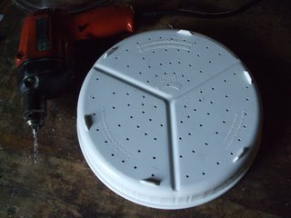 Container with holes drilled in the bottom Holes drilled